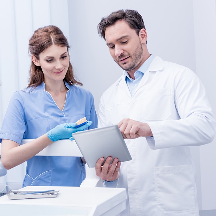 doctor-with-nurse-in-office
